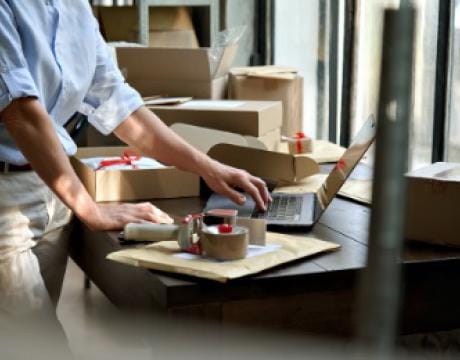 close up of a woman preparing packages